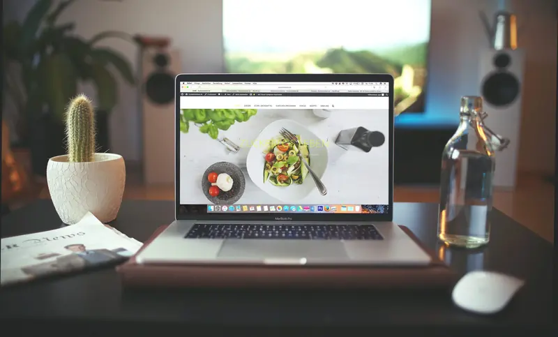 Laptop showing a WordPress website
