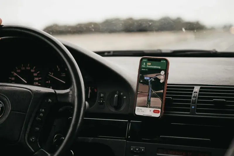 Smartphone with map navigation mounted in a car