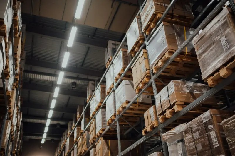 Cardboard boxes on a warehouse shelf