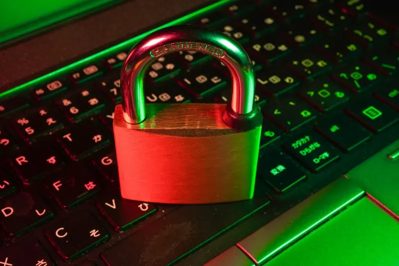Red padlock on a black computer keyboard